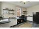 Functional kitchen featuring modern appliances, open shelving, and ample counter space, ideal for everyday meals at 3140 N Washington Blvd, Indianapolis, IN 46205