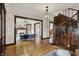 Open-concept living area with hardwood floors, staircase, and an open design to the living room at 3140 N Washington Blvd, Indianapolis, IN 46205