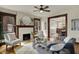 Charming living room with fireplace, stylish furniture, and an open layout to dining area at 3140 N Washington Blvd, Indianapolis, IN 46205