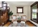 Comfortable living space with hardwood floors, a staircase, and neutral-toned seating at 3140 N Washington Blvd, Indianapolis, IN 46205