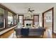 Bright living room with a fireplace, large windows, and a comfortable seating arrangement at 3140 N Washington Blvd, Indianapolis, IN 46205