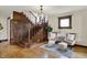 Cozy living room featuring a wooden staircase, decorative lighting, and comfortable seating at 3140 N Washington Blvd, Indianapolis, IN 46205