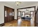 Inviting living room boasts hardwood floors, decorative ceiling light, and beautiful wood accents at 3140 N Washington Blvd, Indianapolis, IN 46205
