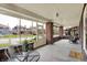 Relaxing screened porch with brick accents, comfortable seating, and a view of the neighborhood at 3140 N Washington Blvd, Indianapolis, IN 46205