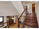 View of the beautiful staircase with wood banister and hardwood floors of home at 3140 N Washington Blvd, Indianapolis, IN 46205