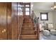 Elegant wooden staircase with detailed craftsmanship, leading to an inviting landing area, offering seamless transition between floors at 3140 N Washington Blvd, Indianapolis, IN 46205