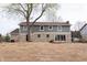 Exterior of home with backyard featuring a large yard and stone and siding exterior at 3316 Eden Way Cir, Carmel, IN 46033