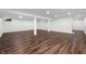 Unfinished basement featuring wood floors and large pillars at 3316 Eden Way Cir, Carmel, IN 46033