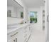Bright bathroom featuring a marble vanity with gold hardware, modern fixtures, and large shower at 3316 Eden Way Cir, Carmel, IN 46033