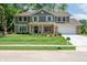 Charming two-story home with a well-manicured lawn and a classic combination of siding and stone accents at 3316 Eden Way Cir, Carmel, IN 46033