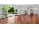 Spacious living room featuring an open layout, hardwood floors, and large sliding glass doors to the yard at 3316 Eden Way Cir, Carmel, IN 46033