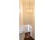 Bright staircase with decorative gold light fixture at 3316 Eden Way Cir, Carmel, IN 46033