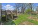 Wooden deck off the back with stairs down to a yard fenced with chain link at 3346 S Lockburn St, Indianapolis, IN 46221