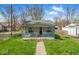 Charming single-story home featuring a cozy front porch and well-maintained lawn at 3346 S Lockburn St, Indianapolis, IN 46221
