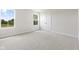 Bright bedroom with two windows, neutral carpet, and a double-door closet at 338 Mcnair Dr, Whiteland, IN 46184