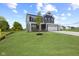 Attractive two-story home with a three car garage, and a well-manicured lawn at 338 Mcnair Dr, Whiteland, IN 46184