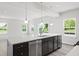 Bright kitchen with white countertops, stainless steel appliances, and a large island at 338 Mcnair Dr, Whiteland, IN 46184