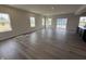 Spacious living room featuring hardwood flooring and lots of natural light at 338 Mcnair Dr, Whiteland, IN 46184