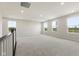 Bright loft space featuring plush carpet, neutral walls, and natural light at 338 Mcnair Dr, Whiteland, IN 46184