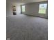 Large main bedroom featuring carpeting and natural light with a view to the ensuite at 338 Mcnair Dr, Whiteland, IN 46184