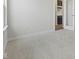 Cozy room featuring plush carpet and views of the kitchen through an open doorway at 338 Mcnair Dr, Whiteland, IN 46184