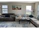 Open-concept living area with ample seating and bright lighting at 3476 Golden Gate N Dr, Carmel, IN 46074