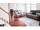 Comfortable seating in a well-lit living space with hardwood floors at 3476 Golden Gate N Dr, Carmel, IN 46074