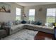 Comfortable living room with large sectional sofa and bright windows at 3476 Golden Gate N Dr, Carmel, IN 46074