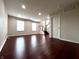 A spacious living room with large windows and hardwood floors at 3476 Golden Gate N Dr, Carmel, IN 46074