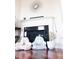 Bright sitting area with decorative fireplace and hardwood floors at 3476 Golden Gate N Dr, Carmel, IN 46074