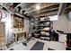 Unfinished basement featuring work bench, workout bench and storage shelves at 3544 Guilford Ave, Indianapolis, IN 46205
