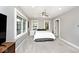 Cozy bedroom with neutral paint, carpet flooring, and bright natural light at 3544 Guilford Ave, Indianapolis, IN 46205