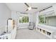 Serene bedroom with large windows, soft natural light, plush carpeting, and a crib; great for a Bedroom at 3544 Guilford Ave, Indianapolis, IN 46205