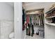 Walk-in closet with ample storage space and built-in shelving; perfect for organizing clothes and accessories at 3544 Guilford Ave, Indianapolis, IN 46205