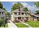 Charming two-story home with brick accents, a well-maintained lawn, and an inviting front porch at 3544 Guilford Ave, Indianapolis, IN 46205