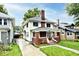 Charming two-story home with a brick chimney and inviting front porch at 3544 Guilford Ave, Indianapolis, IN 46205