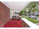 Cozy front porch with outdoor seating and neighborhood views at 3544 Guilford Ave, Indianapolis, IN 46205
