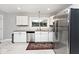 Well lit kitchen featuring white cabinets, stainless steel appliances and granite counters at 3544 Guilford Ave, Indianapolis, IN 46205