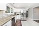 Charming kitchen with white cabinets, stainless steel appliances and granite countertops at 3544 Guilford Ave, Indianapolis, IN 46205