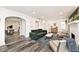 Open-concept living room with hardwood floors and a fireplace at 3544 Guilford Ave, Indianapolis, IN 46205