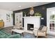 Elegant living room featuring a white brick fireplace and hardwood floors at 3544 Guilford Ave, Indianapolis, IN 46205