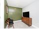 This sitting room features a light gray carpet, comfortable seating, and modern media center at 3544 Guilford Ave, Indianapolis, IN 46205