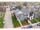 An aerial view of a home with well-manicured front lawn in a vibrant neighborhood during the day at 357 Parkway Ave, Indianapolis, IN 46225