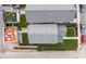 An aerial view of a home showcasing a rooftop deck, manicured lawn and two parking spots at 357 Parkway Ave, Indianapolis, IN 46225