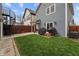Exterior shot of backyard featuring a well-maintained lawn, privacy fence and an outside grill at 357 Parkway Ave, Indianapolis, IN 46225