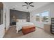 This stylish bedroom includes a ceiling fan, natural light, modern fixtures, and a decorative wood chest at 357 Parkway Ave, Indianapolis, IN 46225