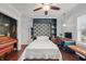 Versatile bedroom with desk, stylish wallpaper, and comfortable daybed at 357 Parkway Ave, Indianapolis, IN 46225