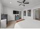 This bedroom features modern decor, light gray walls, a ceiling fan, and two closets with ample space at 357 Parkway Ave, Indianapolis, IN 46225