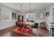 Open dining room featuring wooden table, elegant light fixture, and a view of the outdoor patio at 357 Parkway Ave, Indianapolis, IN 46225
