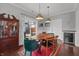 Dining room with wood table, colorful rug, and access to outdoor patio through sliding glass doors at 357 Parkway Ave, Indianapolis, IN 46225